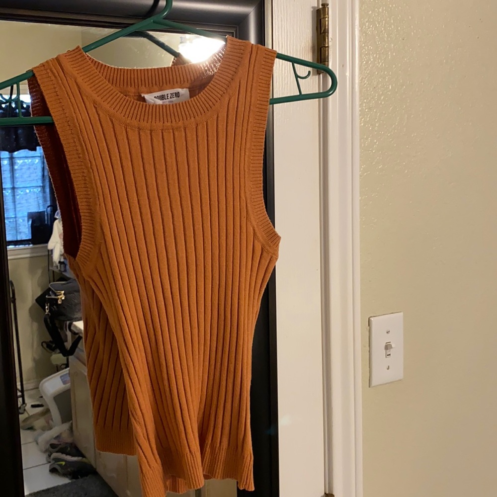 Brand is Double Zero, peachy rust color, size small